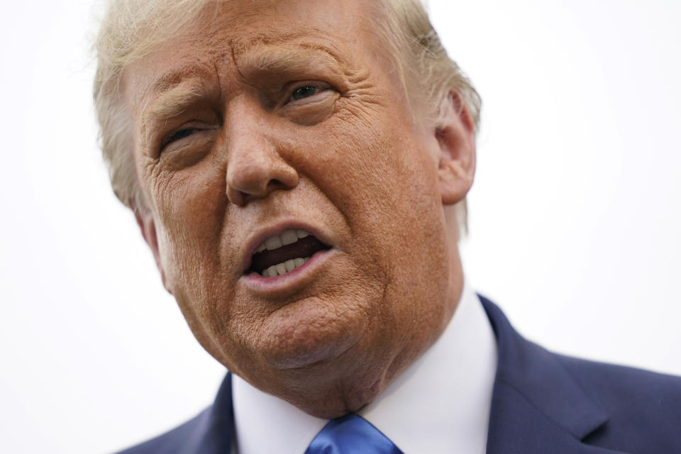 President Donald Trump speaks to members of the press on the South Lawn of the White House in Washington, Thursday, Sept. 24, 2020, before boarding Marine One for a short trip to Andrews Air Force Base, Md. Trump is traveling to North Carolina and Florida. (AP Photo/Patrick Semansky)