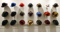 Hats are shown in a Borsalino store in downtown Milan, Italy, Wednesday, Jan. 16, 2019. If the traditional Italian hat-maker Borsalino was once synonymous with the fedora, its new private equity owners want to imbue the brand with cachet that extends to couture, sportswear and streetwear for women and Millennials -- without alienating its classic customers and the silhouette that helped shape the rough-and-tumble images of Robert Redford, Frank Sinatra and, perhaps no one more than, Humphrey Bogart. (AP Photo/Antonio Calanni)