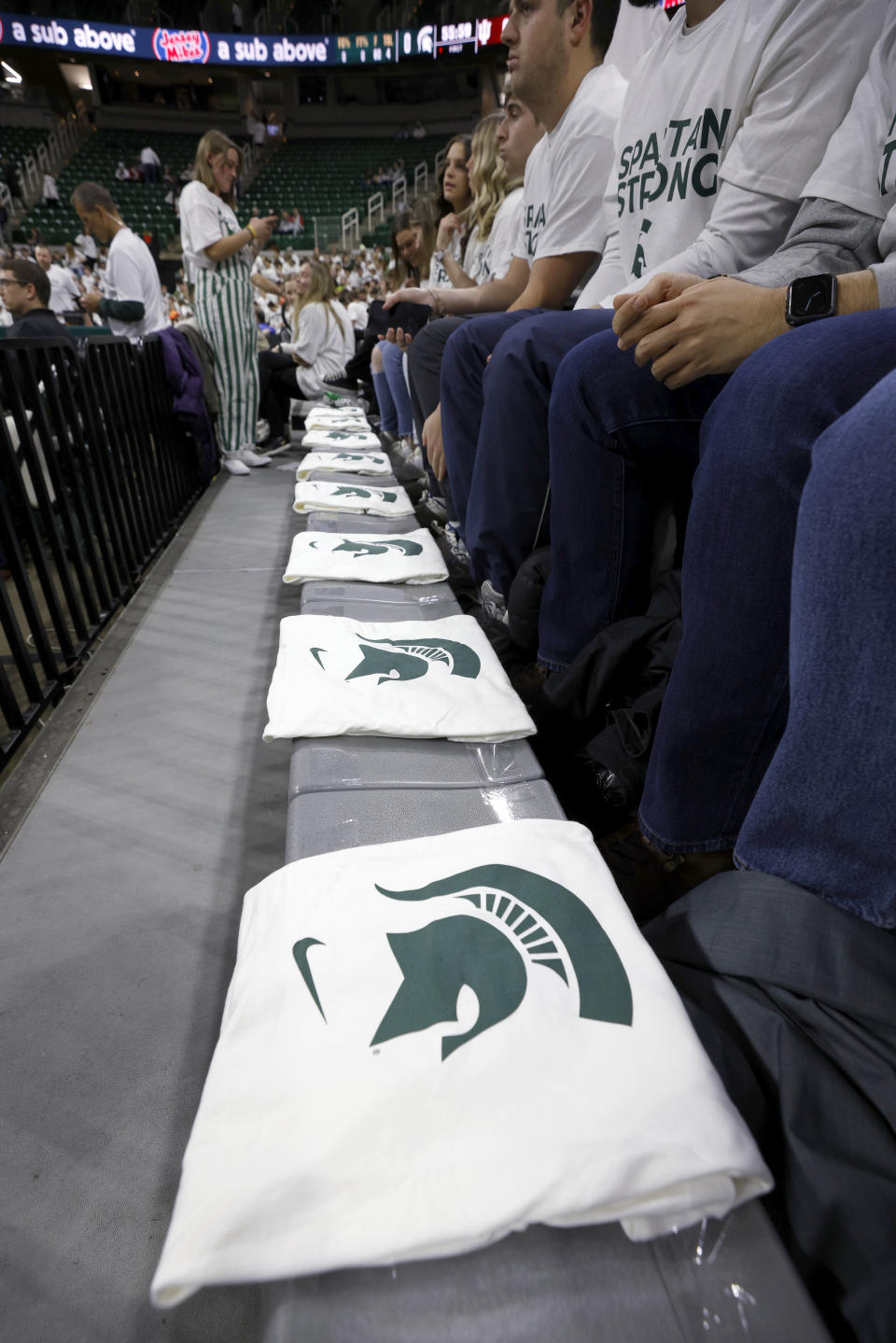 T-shirts are placed in the front row of the Breslin Center for the three killed and five injured Michigan State students before an NCAA college basketball game between Indiana and Michigan State on Tuesday, Feb. 21, 2023, in East Lansing, Mich. (AP Photo/Al Goldis)