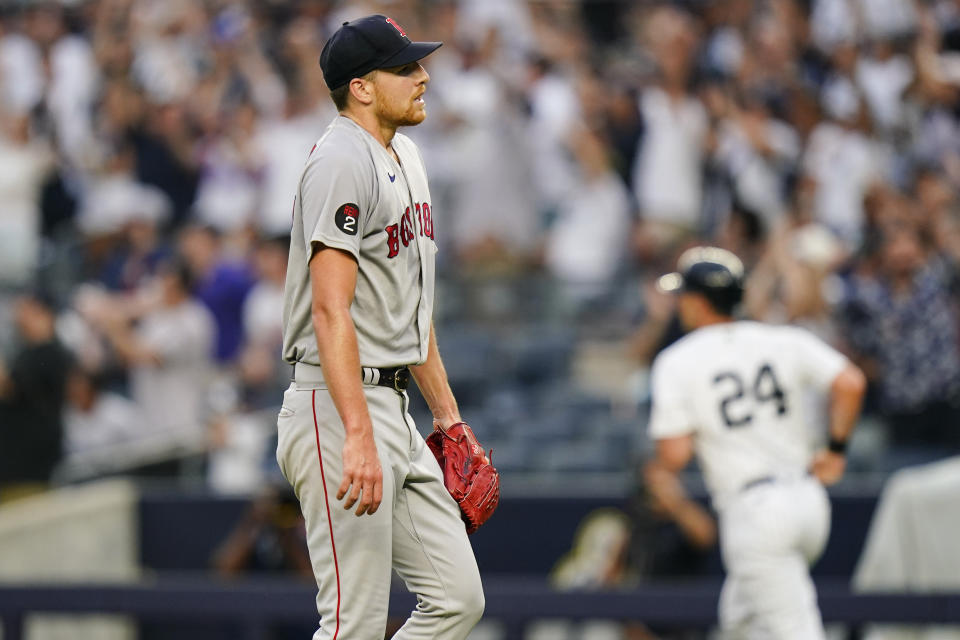 Boston Red Sox's Nick Pivetta reacts as New York Yankees' Matt Carpenter (24) runs the bases after hitting a three-run home run during the first inning of a baseball game Saturday, July 16, 2022, in New York. (AP Photo/Frank Franklin II)