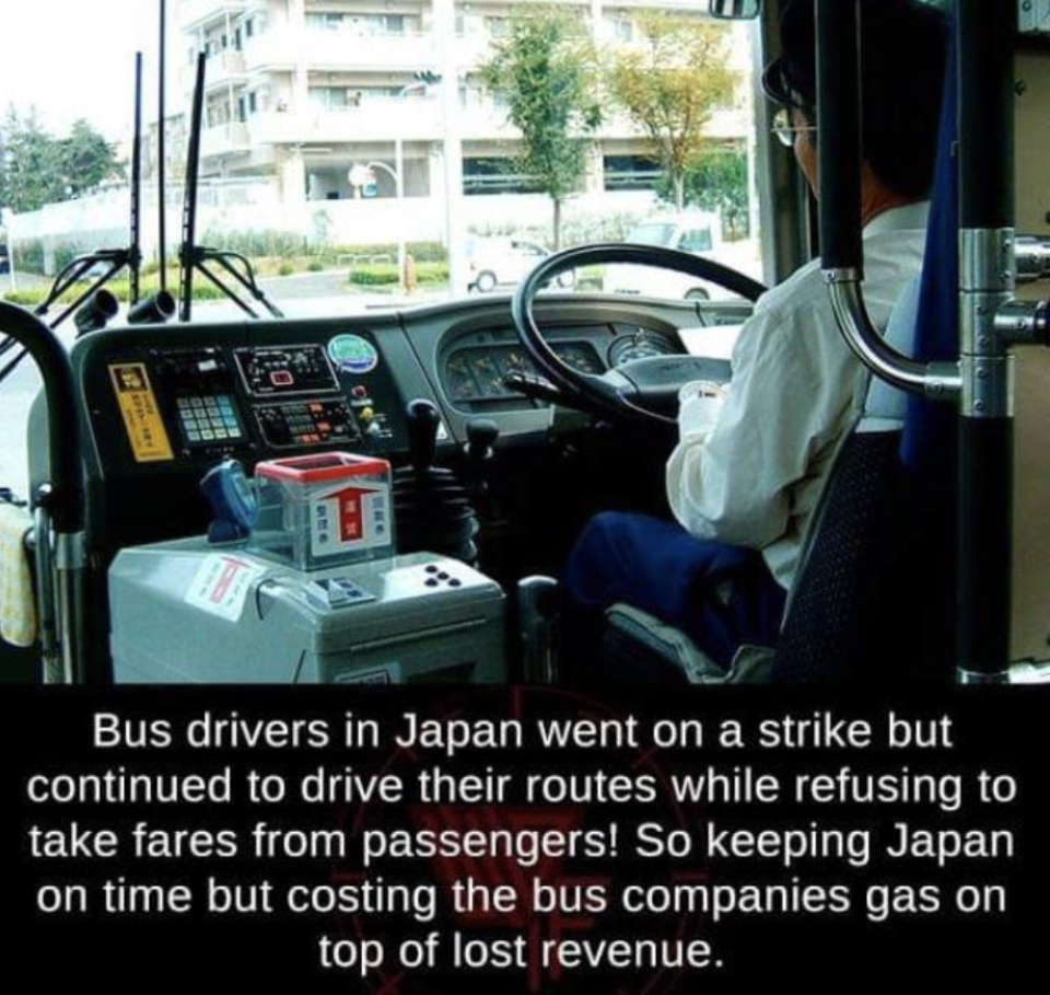 A person driving a bus