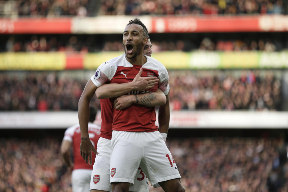 Arsenal's Pierre-Emerick Aubameyang celebrates after scoring his side's opening goal from the penalty spot during the English Premier League soccer match between Arsenal and Tottenham Hotspur at the Emirates Stadium in London, Sunday Dec. 2, 2018. (AP Photo/Tim Ireland)