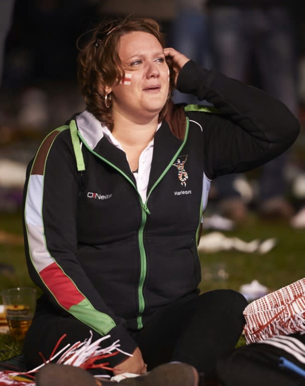 A rugby fans reacts after watching the Pool A match of the 2015 Rugby World Cup between England and Australia at the official Fanzone at Twickenham stadium, south west London on October 3, 2015