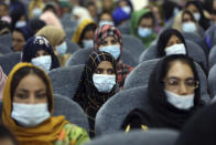 Delegates wearing a protective face masks to help curb the spread of the coronavirus attend an Afghan Loya Jirga meeting in Kabul, Afghanistan, Friday, Aug. 7, 2020. The traditional council opened Friday in the Afghan capital to decide the release of a final 400 Taliban - the last hurdle to the start of negotiations between Kabul’s political leadership and the Taliban in keeping with a peace deal the United States signed with the insurgent movement in February. (AP Photo/Rahmat Gul)