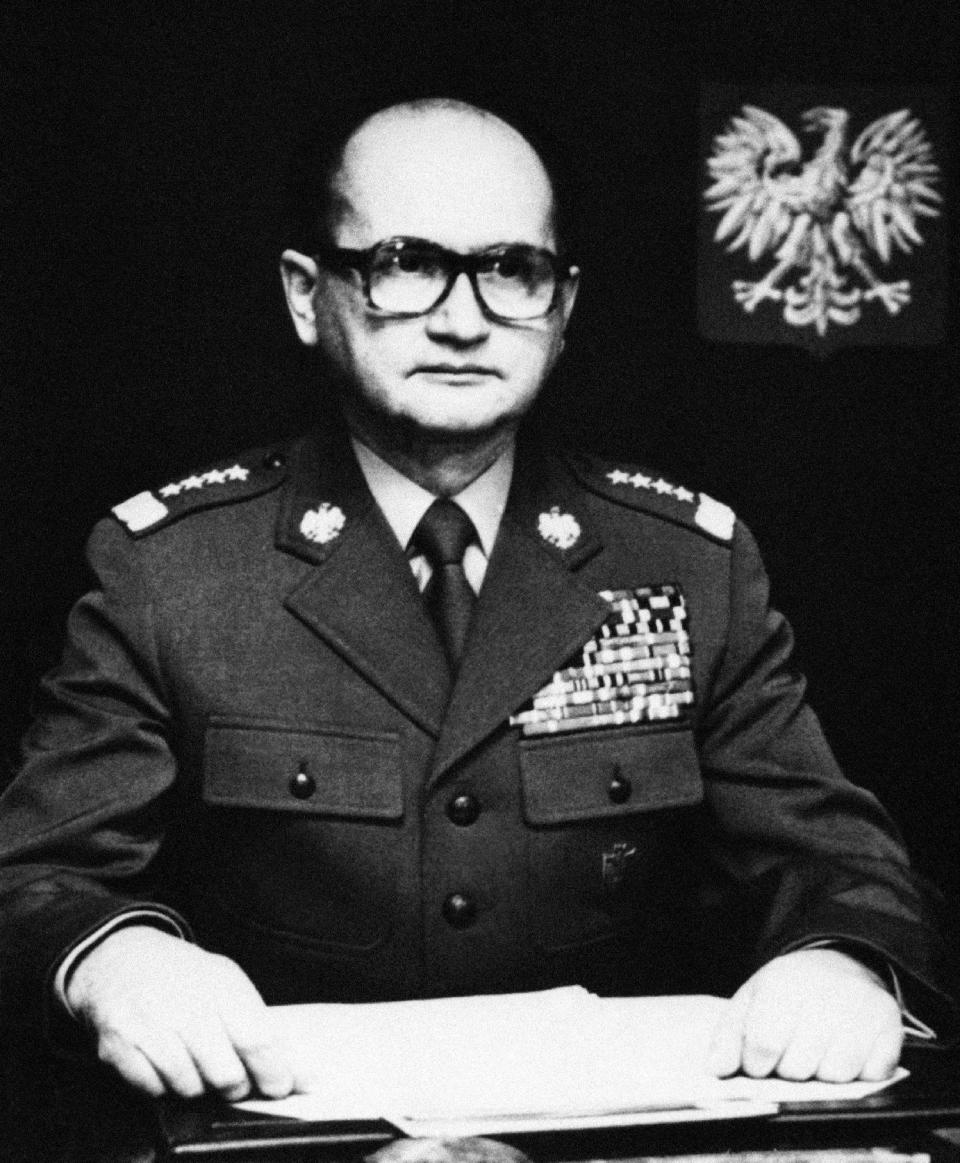 FILE - In this B/W file photo dated Sunday, Dec. 12, 1982, Martial law leader General Wojciech Jaruzeiski announces that the military rule imposed last December 13 in Poland will be suspended by the end of the year. Poland’s government announced Tuesday Dec. 13, 2016, it is taking steps to strip late communist-era leaders Gen. Wojciech Jaruzelski and his deputy, Gen. Czeslaw Kiszczak, of their top military ranks, as part of a mission by the country’s ruling conservatives to seek historical justice against the communists who held oppressive power for decades until they were toppled in 1989. (AP Photo/FILE)
