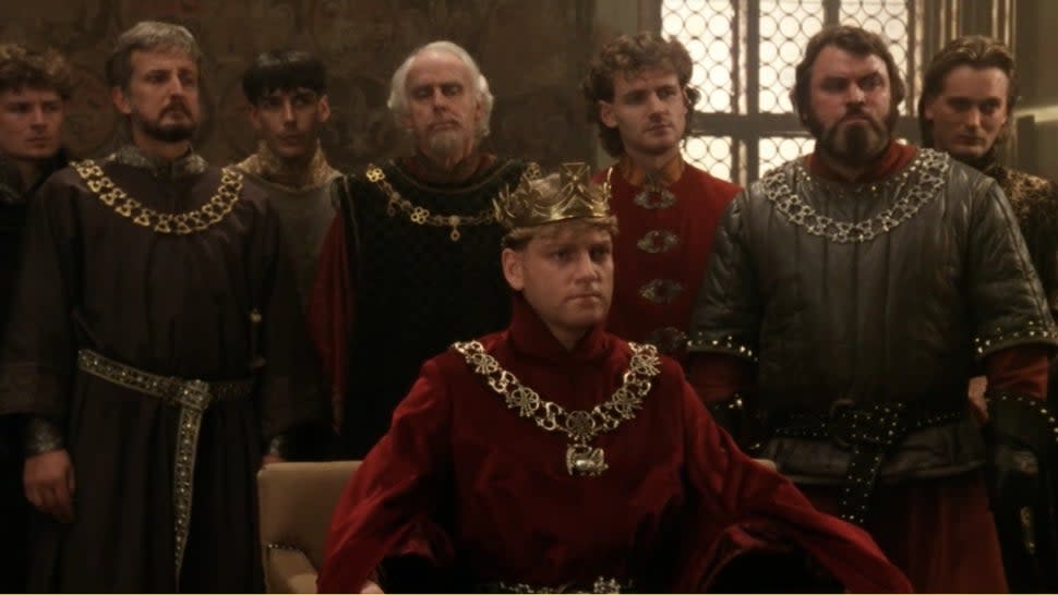 Kenneth Branagh dons a crown while playing Henry V.