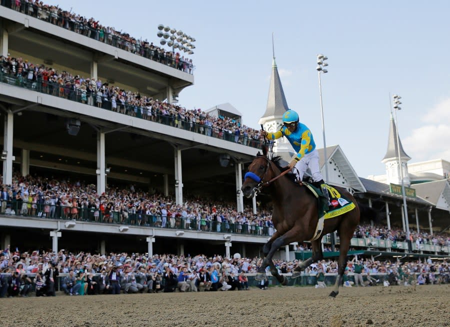 FILE – Victor Espinoza rides American Pharoah to victory in the 141st running of the Kentucky Derby horse race at Churchill Downs in Louisville, Ky., May 2, 2015.(AP Photo/David J. Phillip, File)