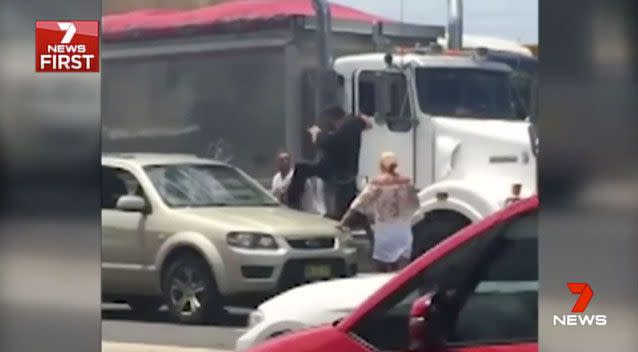 Two men fighting in the middle of a busy Sydney road brought traffic to a standstill. Photo: 7 News