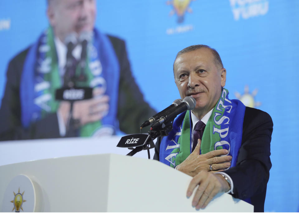 Turkish President Recep Tayyip Erdogan addresses his ruling party's supporters in the Black Sea city of Rize, Turkey, Monday, Feb. 15, 2021. Erdogan laid into the United States, accusing it of supporting Kurdish militants on Monday, days after Turkish troops found the bodies of 13 Turkish soldiers, police and civilians abducted by Kurdish insurgents in a cave complex in northern Iraq.(Turkish Presidency via AP, Pool)