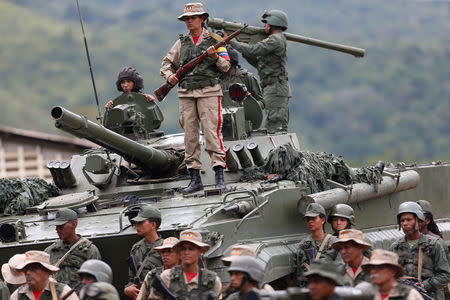 Members of the National Bolivarian Armed Forces attend a news conference. REUTERS/Andres Martinez Casares