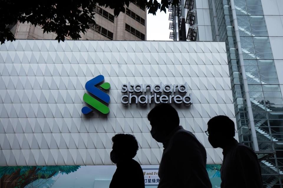 Signage atop a Standard Chartered Plc bank branch in Hong Kong, China, on Tuesday, Feb. 14, 2023. Photographer: Paul Yeung/Bloomberg