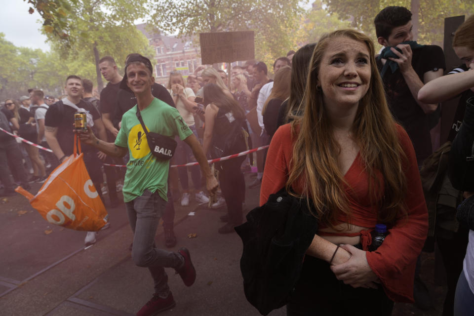 More than 10,000 people joined a protest of organizers and fans of music festivals stage against the government's COVID-19 restrictions on large-scale outdoor events in Amsterdam, Netherlands, Saturday, Sept. 11, 2021. On Saturday, the festivals came to music fans as hundreds of performers and festival organizers called again for demonstration marches through Dutch cities to protest what they argue are unfair restrictions that have forced the cancellation of summer festivals and other events. (AP Photo/Peter Dejong)