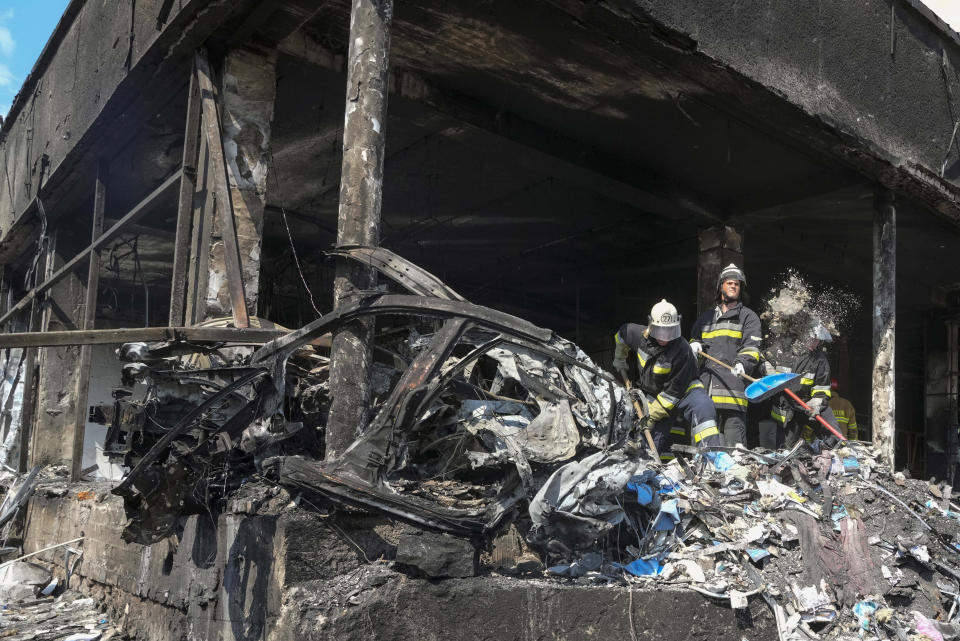 Rescuers work at the scene of a building that was damaged by a deadly Russian missile attack in Vinnytsia, Ukraine, Thursday, July 14, 2022. (AP Photo/Efrem Lukatsky)