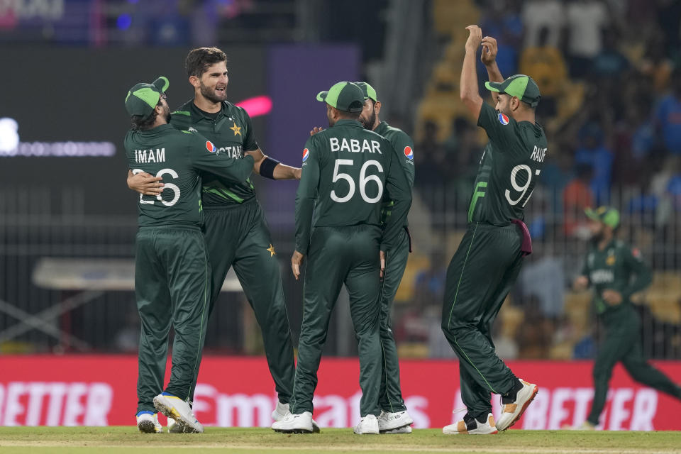 Pakistan's Shaheen Afridi, second left without cap, celebrates the wicket of Afghanistan's Rahmanullah Gurbaz with his teammates during the ICC Men's Cricket World Cup match between Pakistan and Afghanistan in Chennai, India, Monday, Oct. 23, 2023. (AP Photo/Eranga Jayawardena)