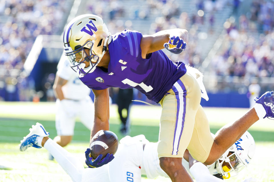 Sep 9, 2023; Seattle, Washington, USA; Washington Huskies wide receiver Rome Odunze (1) runs for yards after the catch against the Tulsa Golden Hurricane during the third quarter at Alaska Airlines Field at Husky Stadium. Mandatory Credit: Joe Nicholson-USA TODAY Sports