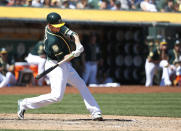 Oakland Athletics' Stephen Piscotty (25) hits a three-run home run against the Los Angeles Angels during the third inning in a baseball game in Oakland, Calif., Thursday, Sept. 20, 2018. (AP Photo/Tony Avelar)