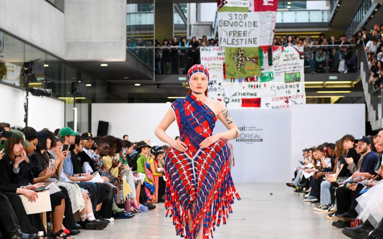 Students unfurled 'Free Palestine' banners above the catwalk of the graduates' show