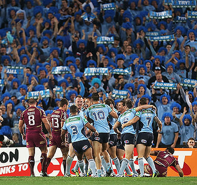 The NSW faithful celebrate the opening try of the game.