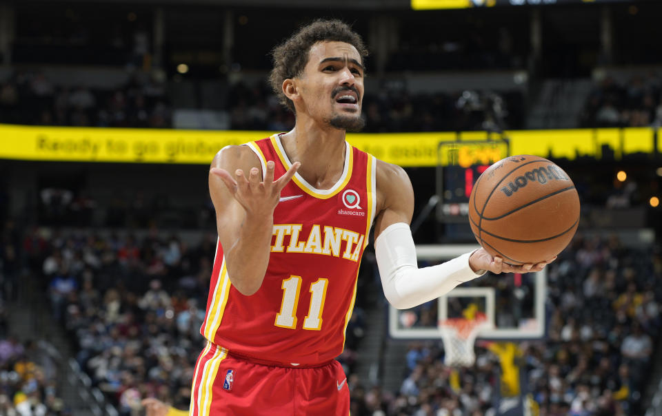 Atlanta Hawks guard Trae Young reacts after being called for a foul against the Denver Nuggets during the second half of an NBA basketball game Friday, Nov. 12, 2021, in Denver. (AP Photo/David Zalubowski)