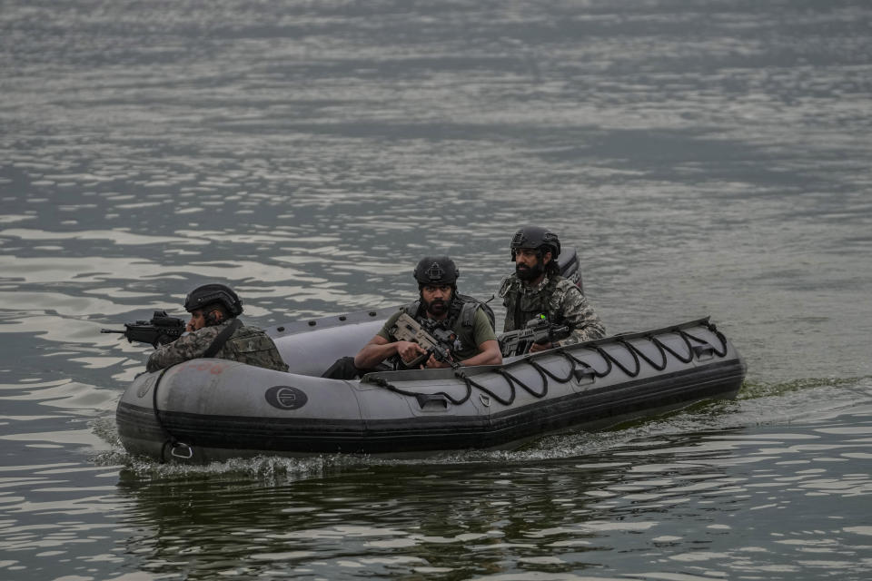 Indian Navy's Marine Commandos patrol the Dal Lake ahead of G20 tourism working group meeting in Srinagar, Indian controlled Kashmir, Wednesday, May 17, 2023. Indian authorities have stepped up security and deployed elite commandos to prevent rebel attacks during the meeting of officials from the Group of 20 industrialized and developing nations in the disputed region next week. (AP Photo/Mukhtar Khan)
