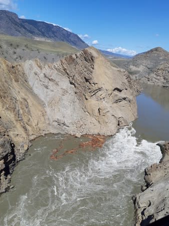 Water flows downstream past the site of the Big Bar landslide on the Fraser River northwest of Clinton