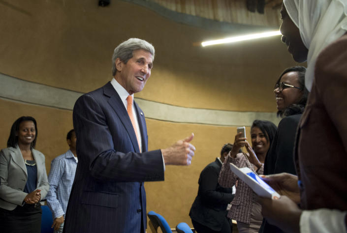 U.S. Secretary of State John Kerry, center, greets students with the Young African Leaders Initiative prior to speaking about U.S. policy in Africa at the Gullele Botanic Garden in Addis Ababa, Ethiopia Saturday, May 3, 2014. America's top diplomat said the U.S. is ready to help increase its ties with Africa, but nations across the continent need to take stronger steps to ensure security and democracy for its people. (AP Photo/Saul Loeb, Pool)