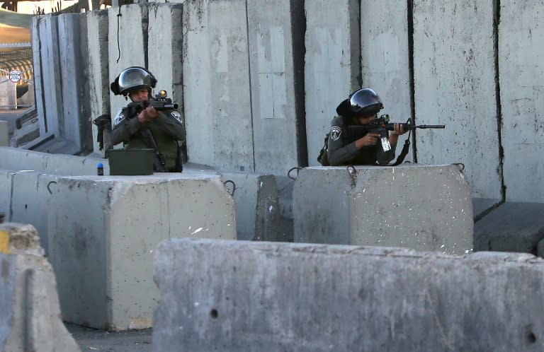 Israeli soldiers man the Qalandia checkpoint between Jerusalem and West Bank city of Ramallah on June 30, 2015