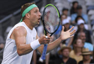 Tennys Sandgren of the U.S. reacts to a line call during his fourth round match against Italy's Fabio Fognini at the Australian Open tennis championship in Melbourne, Australia, Sunday, Jan. 26, 2020. (AP Photo/Andy Brownbill)
