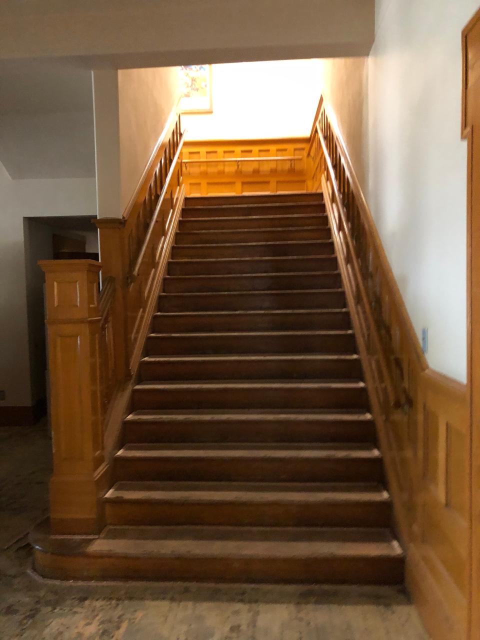 The beautiful stairway in the Bivins Home was actually facing east, in line with the front door, according to earlier information. This shows the bare floor which is being covered with period correct carpet.
