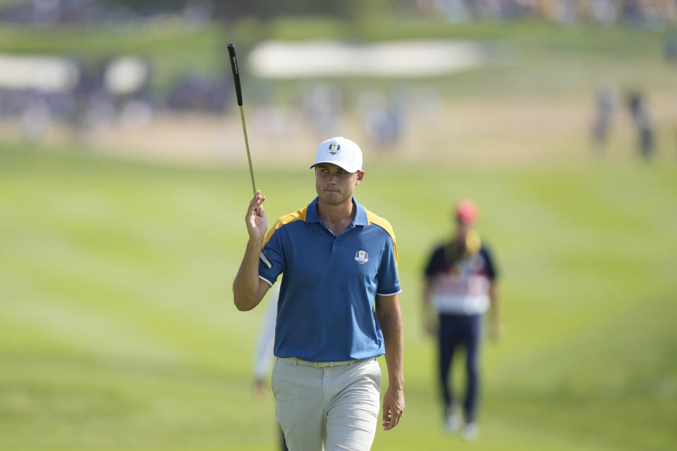 Europe's Ludvig Aberg acknowledges the crowd on the 2nd green during his singles match at the Ryder Cup golf tournament at the Marco Simone Golf Club in Guidonia Montecelio, Italy, Sunday, Oct. 1, 2023. (AP Photo/Andrew Medichini)