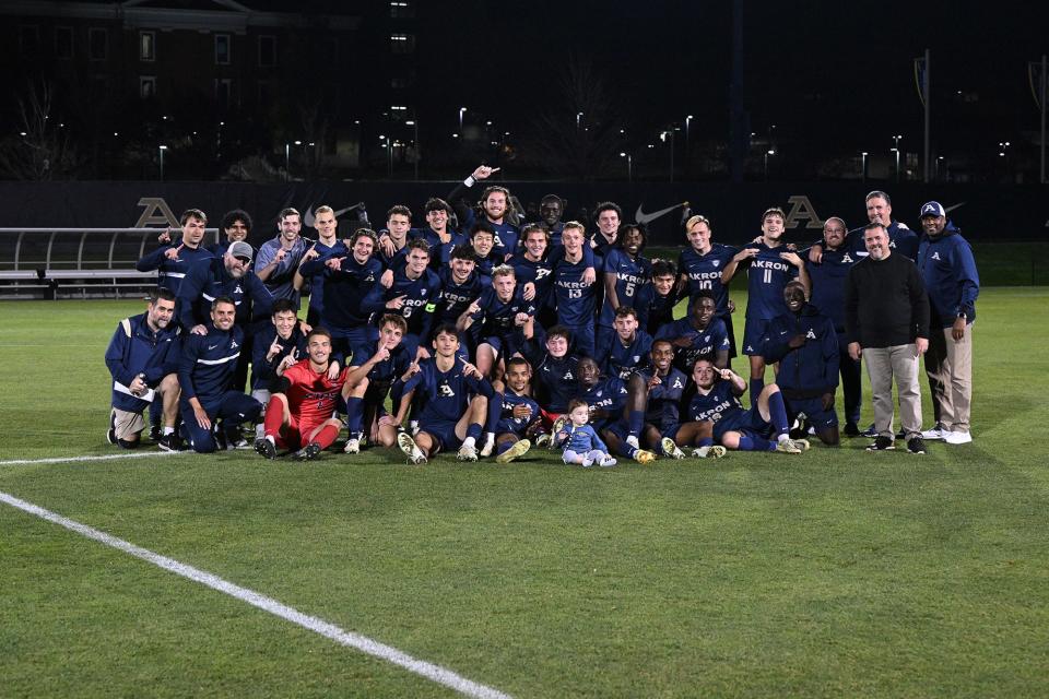 The University of Akron men's soccer team poses after winning the Mid-American Conference regular season title on Nov. 6, 2022.