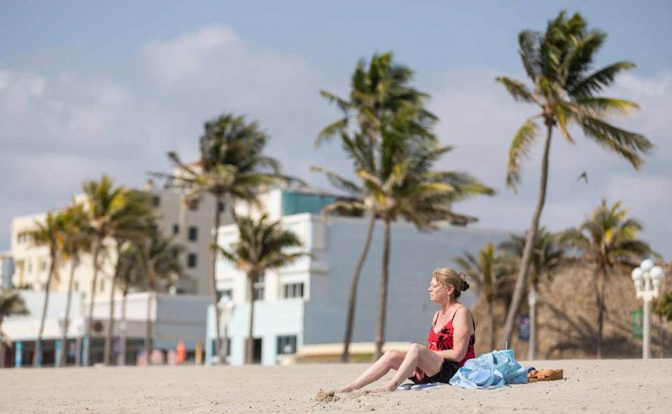 Margaret Pianelli, a tourist from New York, visits the Hollywood Beach Broadwalk as temperatures soar into the 90s on Tuesday, May 14, 2024, in Hollywood, Fla.