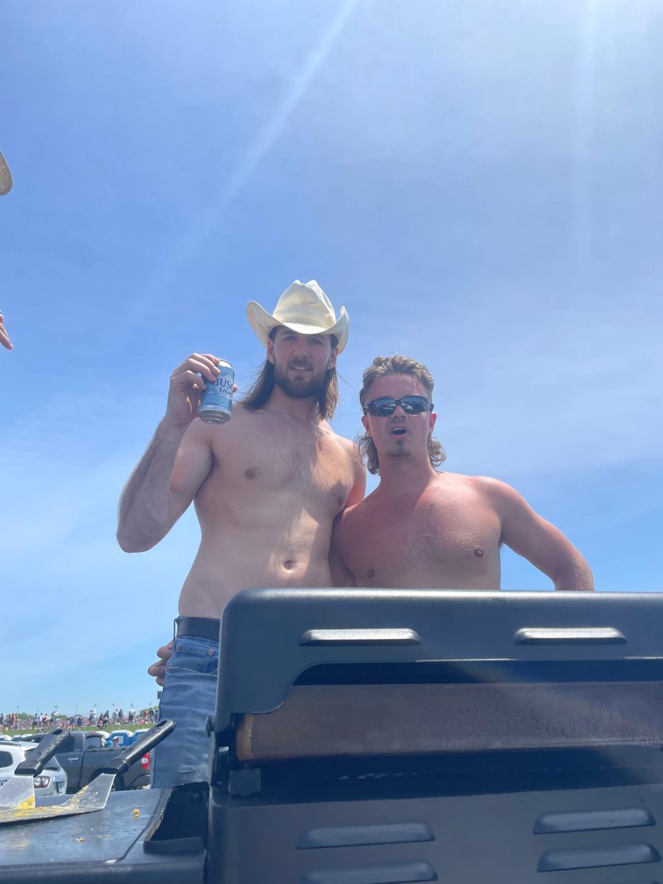 Chase Hamm, left, and Drew Gearheart, right, spent at least part of their race day grilling in a truck bed during the 2022 Indianapolis 500