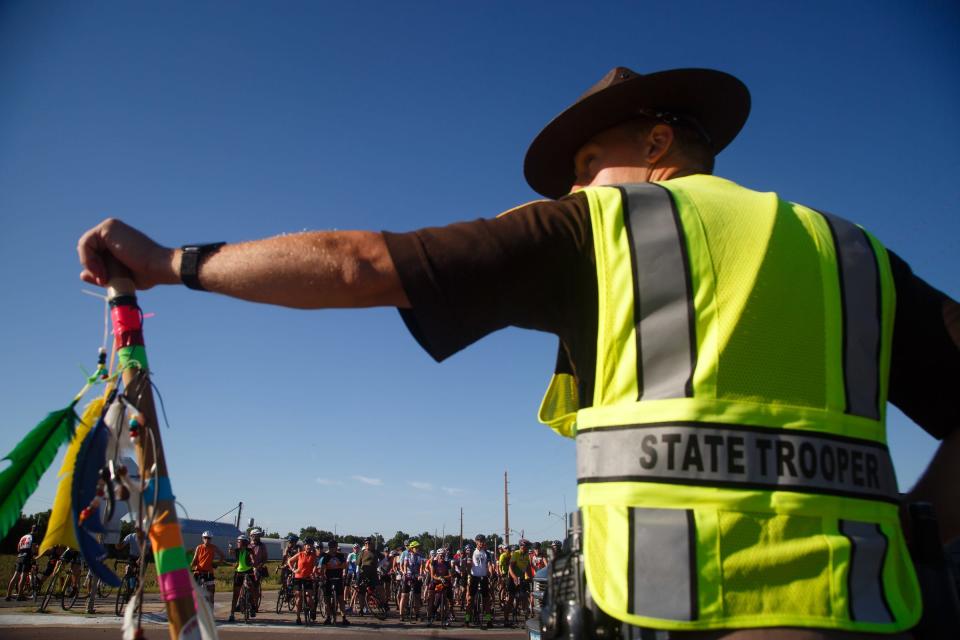 RAGBRAI registration fees help cover the cost of having Iowa State Patrol troopers like Keith Duenow, seen in 2018, maintain traffic safety along the RAGBRAI course.