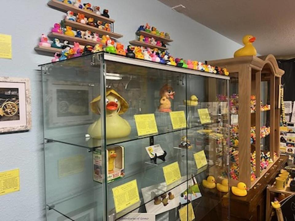 Relics from the history of rubber ducks sit behind a display case at the Rubber Duck Museum in Point Roberts, Wash.