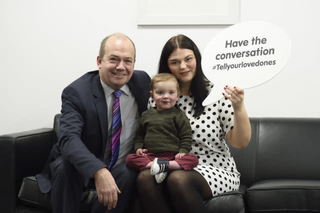 Chief Medical Officer for Northern Ireland, Dr Michael McBride with Seph Ni Mheallain and her son Daithi (Michael Cooper/PA)