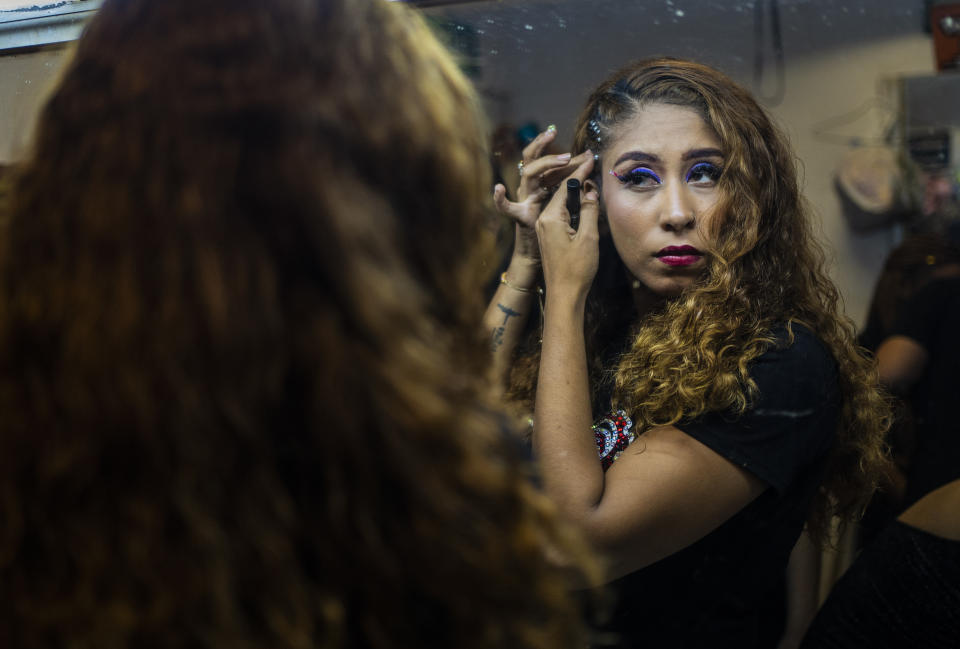 Perla Sanchez gets ready for the semifinals of the first Miss Colonia pageant hosted by the Factoría nightclub in Veracruz, Mexico, Sunday, March 5, 2023. The nightclub held the pageant as part of annual Women’s Day events and the only requirement for contestants was to prove residency in working-class areas of the city, known as "colonias." Prizes originally covered utility bills and property taxes, but when the event attracted more sponsors the prizes expanded to include cash, travel, dental work, spas and makeovers. (AP Photo/Felix Marquez)