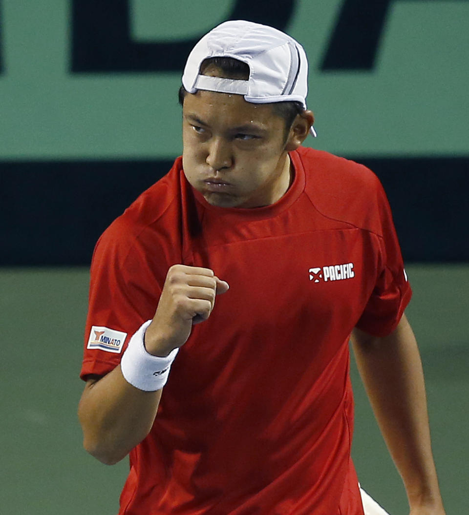 Tatsuma Ito of Japan reacts after getting a point against Radek Stepanek of the Czech Republic during their quarterfinal of Davis Cup World Group tennis at Ariake Colosseum in Tokyo, Friday, April 4, 2014. (AP Photo/Shizuo Kambayashi)