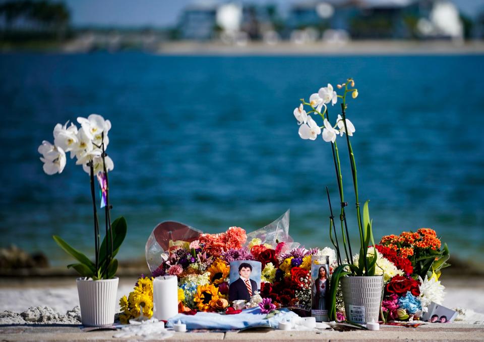 A memorial for 19-year-old Graham McGrath is set up at Lake Como in Fort Myers on Friday, Aug. 25, 2023. Authorities recovered McGrath’s body from the lake Thursday morning after an approximately 16-hour search.
