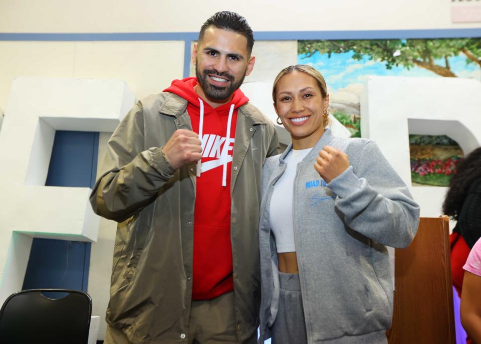 Jose Ramirez (L) and Seniesa Estrada appeared at an event at a Boys & Girls Club in Fresno, California, Wednesday. Ramirez returns after a year's absence to fight Richard Commey while Estrada, the WBA minimumweight champion, fights WBC champion Tina Rupprecht in a unification bout. (Mikey Williams/Top Rank/Getty Images)