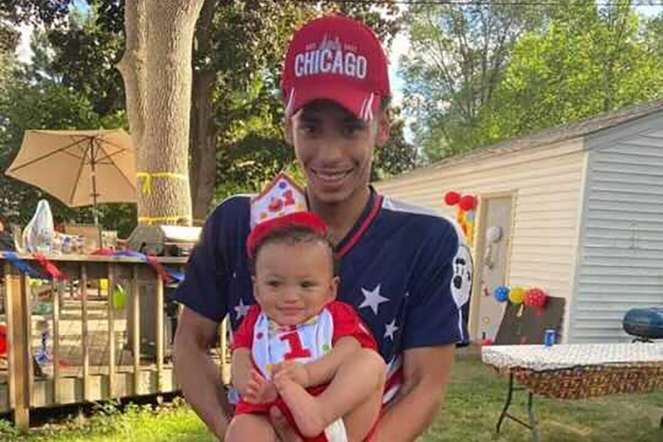 FILE - This photo provided by Ben Crump Law, PLLC. shows Daunte Wright and his son, Daunte Jr., at his first birthday party. Wright, 20, was killed during a traffic stop by a white suburban Minneapolis police officer on Sunday, April 11, 2021. (Ben Crump Law, PLLC. via AP)