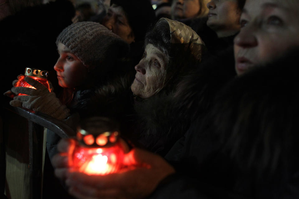 Anti-Yanukovych protesters attend a rally at Kiev's Independence Square, the epicenter of the country's current unrest, Ukraine, Wednesday, Feb. 26, 2014. Ukraine has been consumed by a three-month-long political crisis. President Viktor Yanukovych and protest leaders signed an agreement last week to end the conflict that left more than 80 people dead in just a few days in Kiev. Shortly after, Yanukovych fled the capital for his powerbase in eastern Ukraine but his exact whereabouts are unknown. (AP Photo/Marko Drobnjakovic)