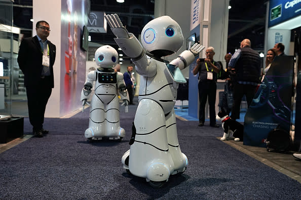 The U-Partner U05 humanoid service robots by Canbot, featured with free speech interaction, microsecond-level face recognition, autonomous obstacle avoidance walking, bionic action control and smart home hub, greet attendees during CES 2018, which runs through Jan. 12. (Photo by Alex Wong/Getty Images)