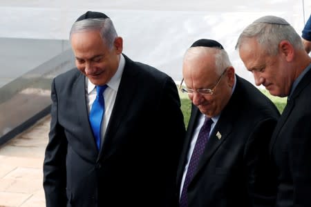 Israeli Prime Minister Benjamin Netanyahu, Israeli President Reuven Rivlin and Benny Gantz, leader of Blue and White party, attend a memorial ceremony for late Israeli President Shimon Peres, at Mount Herzl in Jerusalem