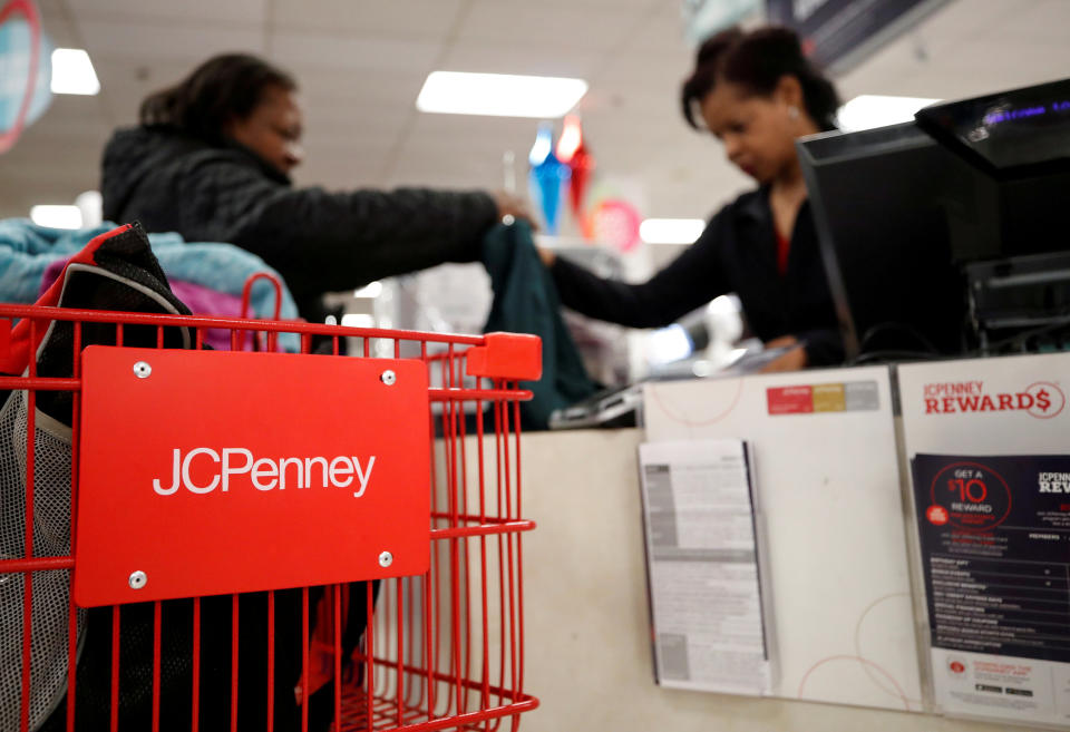 A JCPenney employee helps a customer with her purchase at the JCPenney department store in North Riverside, Illinois, U.S., November 17, 2017. REUTERS/Kamil Krzaczynski/File Photo