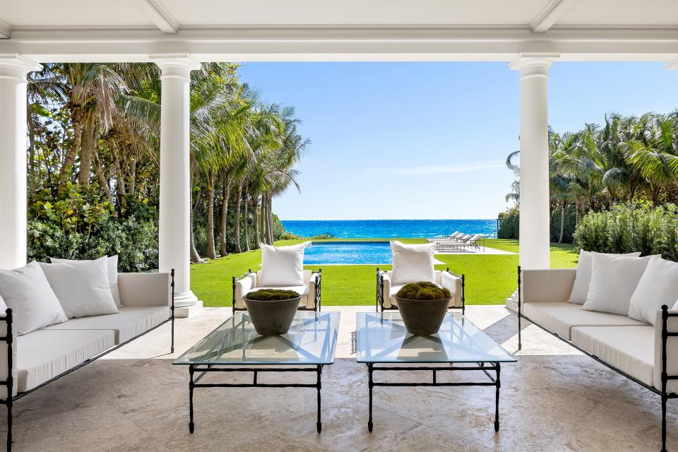 With a veranda above it, the main-level loggia looks out to a swimming pool and the Atlantic Ocean at 2315 S. Ocean Blvd. in Palm Beach. The renovated estate is priced at $78.5 million.