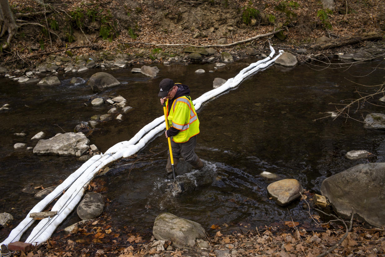 Image: An EPA Emergency Response employee checks for chemicals and signs of fish at the Leslie Run Creek in East Palestine on Feb. 20, 2023. (Michael Swensen / Getty Images)