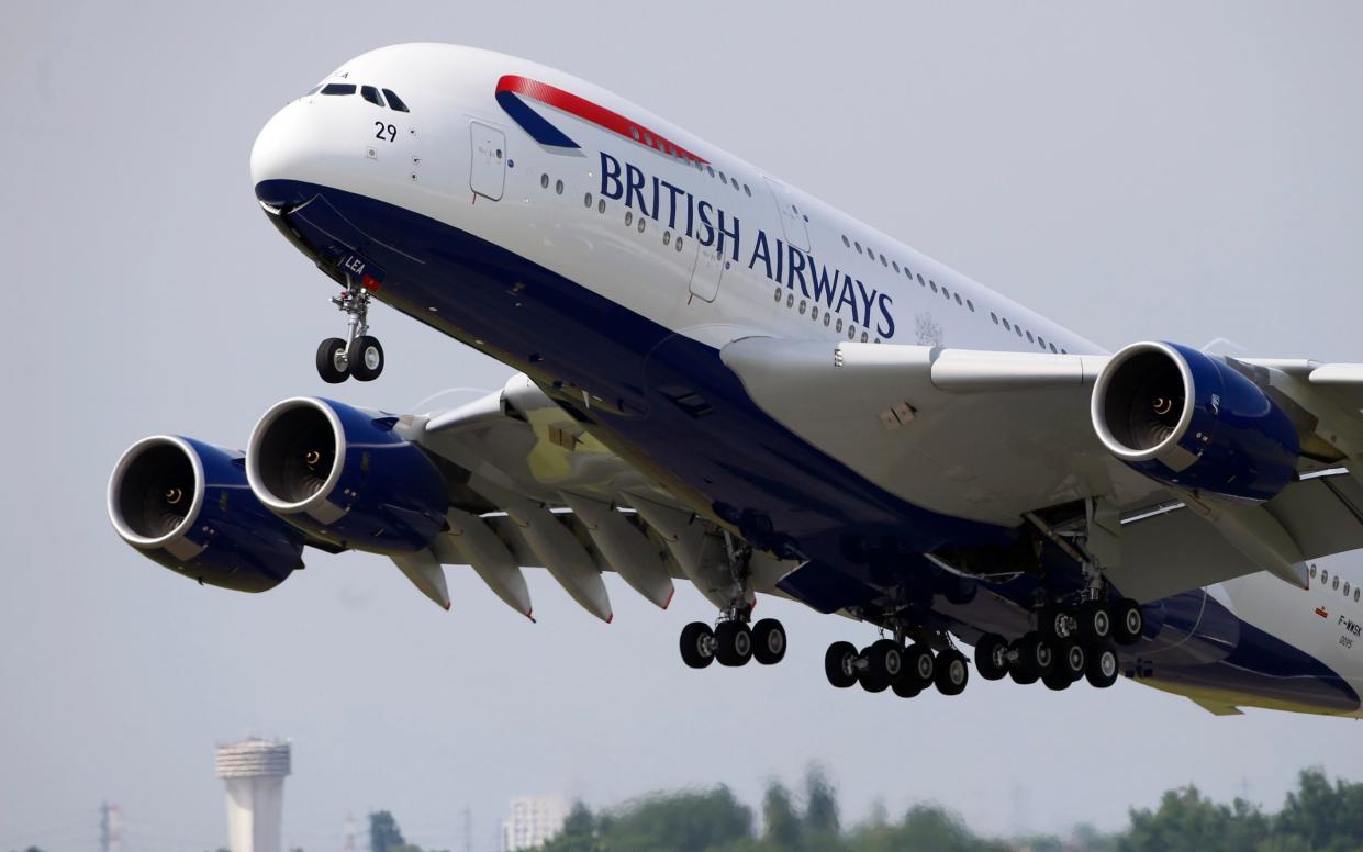 BA flight taking off - Francois Mori/AP Photo