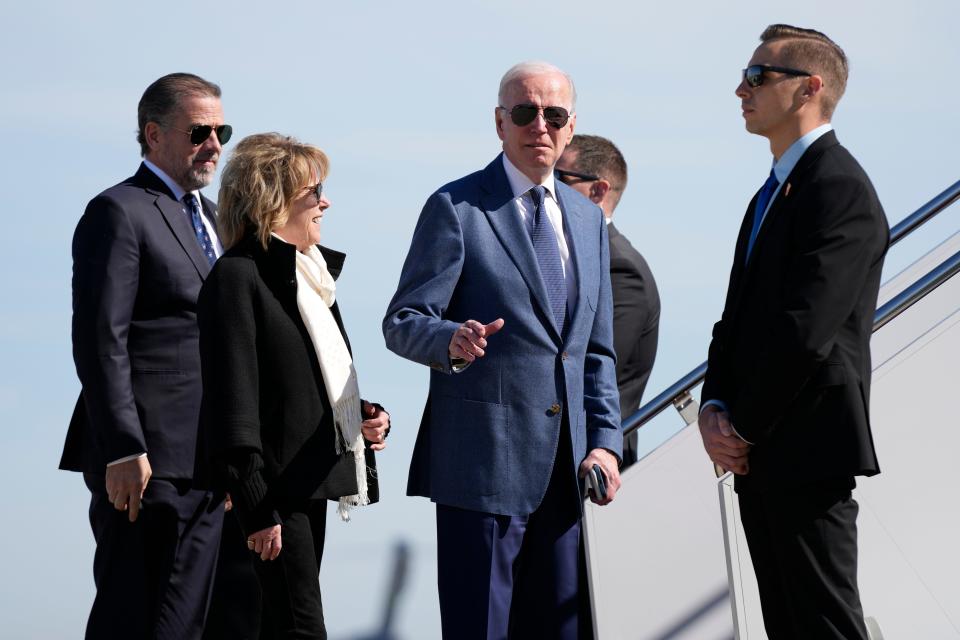 President Joe Biden gestures before he walked over to talk with reporters before boarding Air Force One, Tuesday, April 11, 2023, at Andrews Air Force Base, Md.