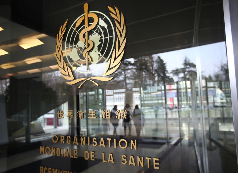 A logo is pictured outside a building of the WHO in Geneva